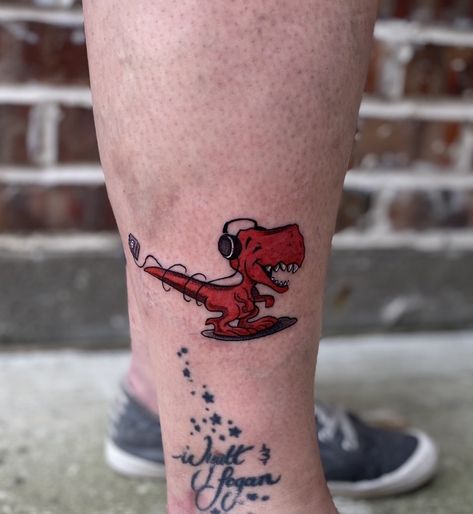 Dinosaur With Headphones, Cute Dino Tattoo, Dave Tattoo, Free Bird Tattoo, Dino Tattoos, Lightsaber Tattoo, Headphones Tattoo, Dino Tattoo, Car Flash