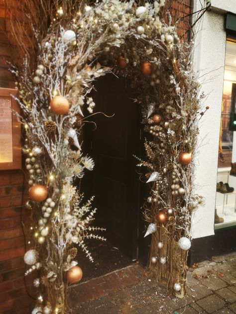 xmas archway created for The Olive Tree Brasserie in Stockton Heath, England Christmas Door Arch, Christmas Archway Outdoor, Christmas Archway Decor Indoor, Christmas Arches, Ornament Arch, Christmas Archway, Christmas Tree Arch, Archway Decor, Christmas Arch