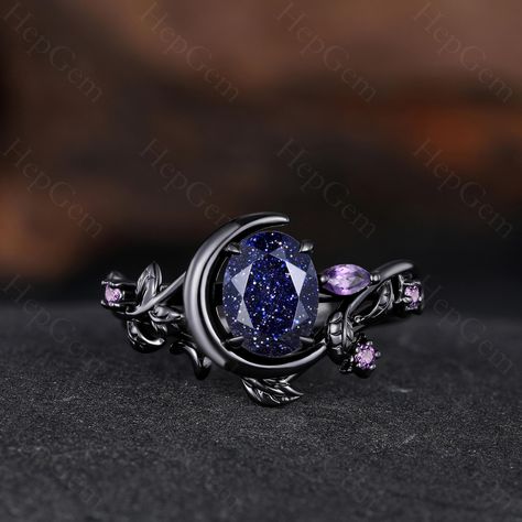 Blue Sandstone Engagement Ring, Unique Ring for Her, Gothic Black Gold Ring for Women, Moon Style Weeding Ring Main Stone: 6x8mm Oval Cut Blue Sandstone. Side Stone: Amethyst Band Width: Approx. 1.6mm Our Services: All sizes are available, if you need other ring sizes, please feel free to contact me. Production Time: Since all rings are handmade according to orders, it takes about 13-15 working days (excluding weekends) to make, and 3-5 working days to arrive, thank you for your understanding. Expedited Order: We provide expedited order service, it takes about 7-10 working days (excluding weekends) to complete the ring, and 3-5 working days to arrive, if you are in a hurry to get the ring, please contact me. Payment Plan: We offer payment plan, you can pay weekly or monthly, we will keep t Engagement Ring Star, Acotar Engagement Ring, Engagement Rings Moon, Witch Engagement Ring, Dark Engagement Ring, Witchy Engagement Ring, Gothic Engagement Rings, Moon Engagement Ring, Blue Sandstone Ring