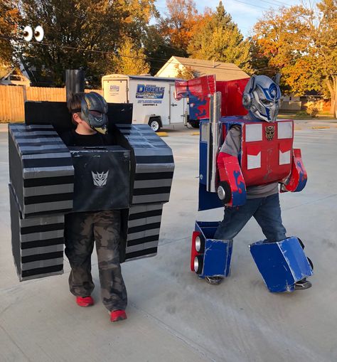 Optimus Prime vs Megatron Megatron Costume, Optimus Prime Vs Megatron, Optimus Prime Costume, Dog Costume, Optimus Prime, Costume Ideas, Transformers, Halloween Costume, Halloween Costumes