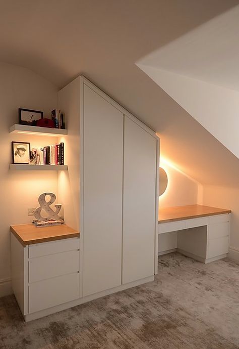 Wardrobe, drawers and dressing table/desk with integrated lighting. Bespoke furniture to fit under pitched roof. White lacquered with Oak desktop. Bedroom Attic Ideas, Attic Shower, Attic Bedroom Storage, Slanted Walls, Diy Bedroom Storage, Attic Lighting, Bathroom Wood, Closet Diy, Two Bedroom House