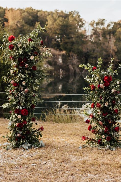 Gorgeous ceremony backdrop made from burgundy and blush roses and lush greenery in an organic asymmetrical shape. Sweetheart Table Backdrop, Burgundy Background Aesthetic, Winter Ceremony, Burgundy And Blush Wedding, Table Backdrop, Modern Christmas Decor, Wedding Ceremony Backdrop, Organic Wedding, Ceremony Decor