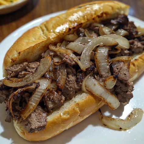 Indulge in a savory Philly Cheesesteak Grilled Sandwich with caramelized onions! Perfect for lunch or dinner. 🥪🧅 #PhillyCheesesteak #GrilledSandwich #ComfortFood Onion Steak, Cheesesteak Sandwich, Steak And Onions, Philly Food, Athlete Nutrition, Cheese Steak Sandwich, Ravioli Recipe, Grilled Onions, Philly Cheesesteak