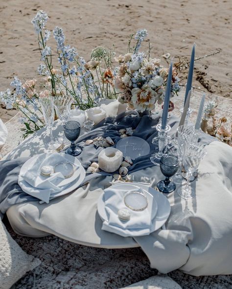 Looking for something blue? Finding something blue for wedding is a tough task...because there is so many lovely options! Check out our article to browse the special blue touches you can make to your wedding ceremony, wedding dress, or wedding decor. Something blue before I do? Sounds good to us! A wedding table on the beach adorned with blue and pink flowers, blue tapered candles and blue tableware Blue Tapered Candles, Something Blue Ideas, Blue And Peach Wedding, Ceremony Wedding Dress, Sand Diego, Blue For Wedding, Beach Wedding Inspo, Ocean Wedding Theme, Nautical Wedding Inspiration