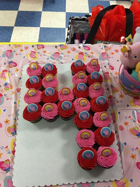 Peppa Pig number 4 cupcake cake with Peppa Pig rings on top. Number 4 Peppa Pig Cake, Number 4 Cupcakes, 4 Cupcake Cake Number, Number 4 Cupcake Cake, 4 Cupcake Cake, Kids Birthday Cupcakes, School Cupcakes, Curious George Birthday Party, Number Birthday Cakes