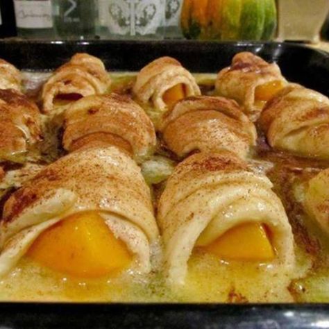 Peach Dumplings made with Mt. Dew (and crescent rolls) [if peaches aren't in season use 2 cans of sliced peaches in JUICE]or use apple pie filling with7-up.. Peach Crescent Rolls, Peach Dumplings, Crescent Recipes, Apple Dumplings, Peach Desserts, Crescent Roll Recipes, Peach Recipe, Dumpling Recipe, Sweet Sauce