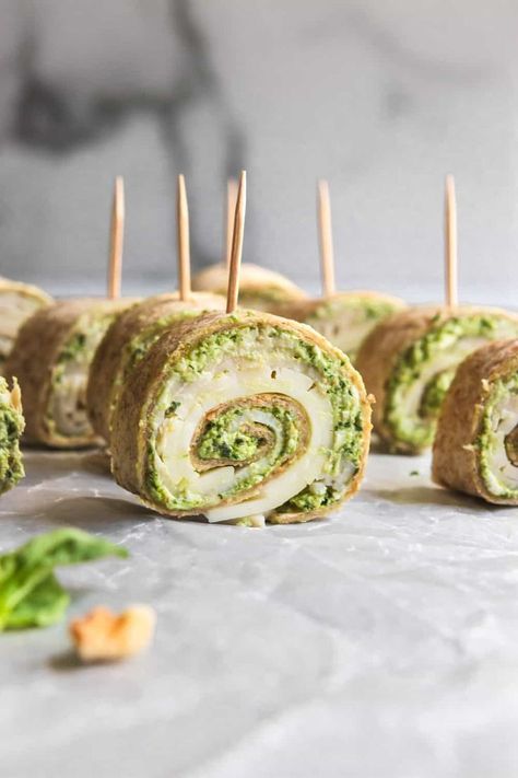 Loaded with fresh ingredients, these Pesto Turkey Pinwheels are perfect for a simple lunch, party platter or even a snack. Smoked provolone pairs well with this turkey and wrapped in a pesto cream cheese mixture that you will be coming back for more again and again! Tortilla Pinwheels Recipe, Pesto Turkey, Turkey Pinwheels, Tortilla Pinwheels, Pinwheel Sandwiches, Cheese Pinwheels, Skillet Dinner Recipes, Pinwheel Appetizers, Tortilla Rolls