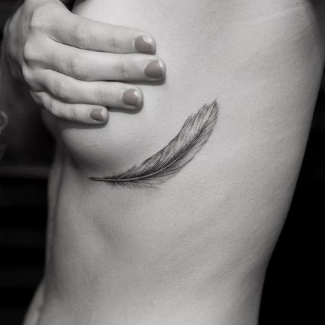 50 Beautiful Feather Tattoo Designs | Page 4 of 5 | TattooAdore Feather Underboob Tattoo, Feather Rib Tattoos, C Section Scar Tattoo, Courage Tattoos, Mastectomy Tattoo, Native American Tattoos, K Tattoo, Scar Tattoo, Feather Tattoo Design