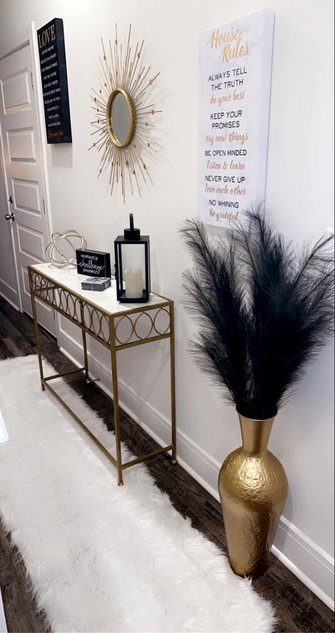 Edgy Chic Home Decor, Vase With Feathers Decor, Aesthetic Hallway Ideas, Glass Entryway Table Decor, Black White And Gold House Aesthetic, Cream House Decor, Black And White Home Decor Living Room, Living Room Decor For Apartments, Apartment Stairway Decorating