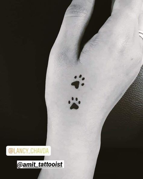 Two Black Dog Paws Tattoo On Hand Small Tattoo Ideas Back, Paws Tattoo, Tattoo Paw, Serendipity Tattoo, Tattoo Ideas Back, Mickey Tattoo, Tattoo Leggings, Dog Memorial Tattoos, Pawprint Tattoo