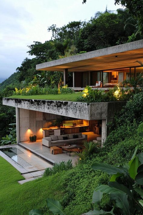 Earth sheltered modern house built into hillside overlooking a tropical mountains. Check out all of these stunning houses built into the hillside that look like they belong in a fairy tale. House On Inclined Land, Tiny House On A Hill, House On Side Of Hill, Houses Built Into Hillside Design, Glen Murcutt Houses, Tropical Hillside House, Buildings Built Into Hillsides, Steep Hillside House Plans, House On Hill Design