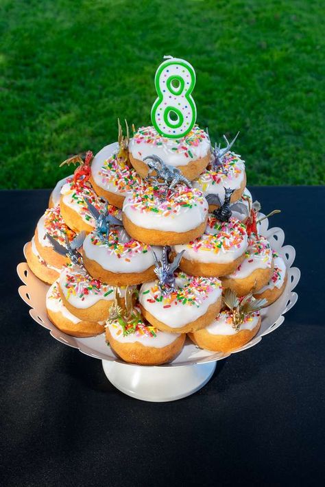 Dragon donut cake Doughnut Cakes Birthday, Cake Made Of Donuts Birthday, Donut Stacked Cake, Cake Made Out Of Donuts Birthday, Tiered Donut Cake, Dount Cake Birthday, Doughnut Cake Ideas, Donut Cakes Birthday, Doughnut Birthday Party Ideas