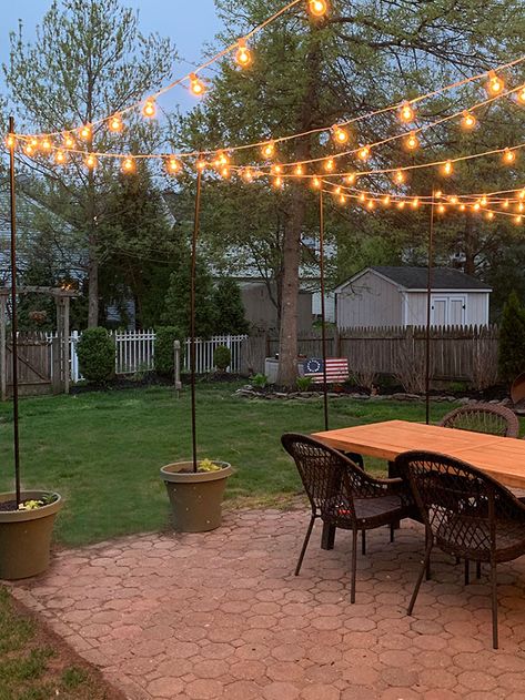 This is an easy way to add string lights over a patio without having those chunky wood beams Backyard String Lights, Outdoor String Lights Patio, Diy String Lights, Patio String Lights, Backyard Lighting, Outdoor Patio Lights, Outdoor Backyard, Patio Lighting, Backyard Patio Designs