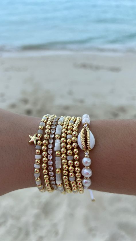 Seashell, Gold + Pearl Adjustable Closure Bracelet Wear it on its own or stacked with your other Golden Party Jewels for the perfect golden arm party. Gold Bracelet Preppy, Beachy Bracelet Stack, Coastal Granddaughter Bracelets, Beach Jewelry Aesthetic, Bracelet Combos, Pearl Bracelet Stack, Braclets Gold, Golden Party, Beachy Bracelets