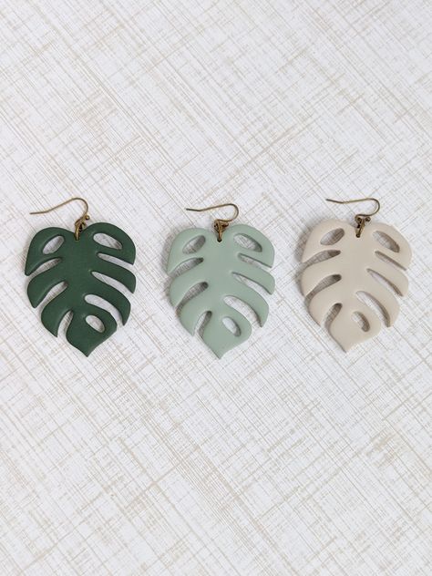 Every piece of Valerie's Handcrafted Jewelry is just that, handcrafted by me, Valerie.  This takes time, patience and care for each product I put out.  Handcrafting each piece gives it character and truly makes it one of a kind.  Disclaimer: - The lighting in the photo may alter the appearance of the actual product. Clay Monstera Leaf, Monstera Earrings, Monstera Leaf Earrings, Plant Earrings, Earrings Polymer Clay, Fish Hook Earrings, Earring Tree, Leaf Earrings, Hook Earrings