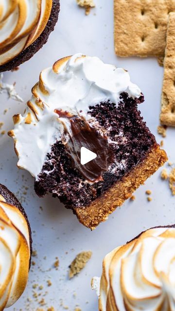 Maddie & Jules on Instagram: "S’mores cupcakes start with a chocolate cupcake then get filled with chocolate ganache and topped with a fluffy torched marshmallow topping.

Full s’mores cupcake recipe linked in bio or visit https://kitchen-by-the-sea.com/smores-cupcakes/

Graham cracker crust:
1.5 cups graham crackers 1 package
⅓ cup butter melted
¼ cup sugar
Cupcakes:
1 cup sugar
7/8 cup flour 105 grams
3/8 cup cocoa powder 36 grams
1 teaspoon baking soda
½ teaspoon baking powder
½ teaspoon salt
1 egg
1 teaspoon vanilla
1/4 cup neutral oil
1/2 cup buttermilk
½ cup hot coffee
Ganache:
2.5 oz chopped chocolate
2 tablespoons butter
⅜ cup sugar
⅜ cup heavy cream
1 teaspoon vanilla
Pinch of salt
Marshmallow frosting:
4 egg whites
1 cup sugar
¼ teaspoon cream of tartar
1 teaspoon vanilla or 1 ta Toasted Smores Cupcakes, Smores Graham Cracker Cups, Marshmallow Stuffed Cupcakes, Cupcake Recipes Smores, Smore Cupcakes, S’more’s Cupcakes, S’mores Cupcakes Easy, S’more Cupcake Recipe, Coffee Ganache