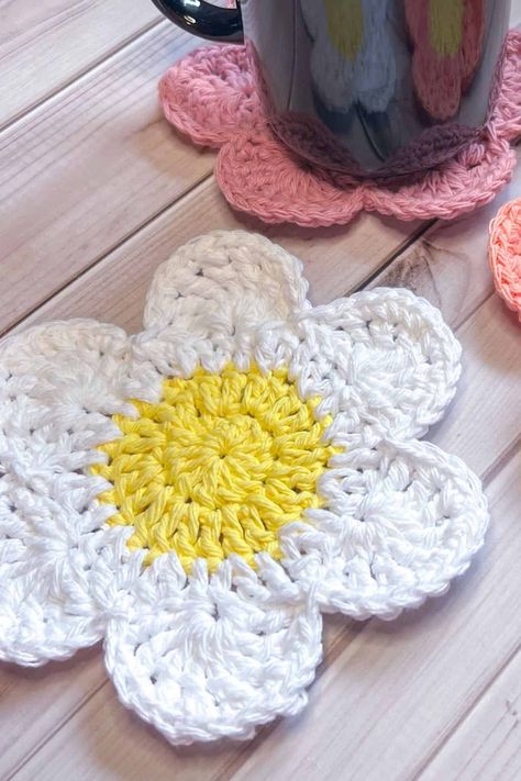 Brighten up your home space by making my Crochet Flower Coaster Pattern with 6 Petals! The crochet flower coasters are perfect for Spring, Summer, or the whole year really! Crochet Flower Coasters Free Pattern, Crochet Flower Coaster Pattern, Flower Coaster Pattern, Crochet Flower Coaster, Flower Coaster, Flower Coasters, Coaster Pattern, Easy Crochet Projects, Crochet Daisy