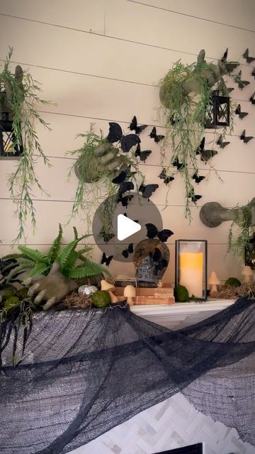 Mariah Leeson on Instagram: "Nature meets creepy as gnarled hands claw through the wall and set the macabre mood for this elegant yet eerie Haunted Garden Halloween Mantel. 

These creepy arms from Oriental Trading are the focal point of this year’s Halloween decorations, and I am obsessed!  Cascading vines and moss give the impression of a once-vibrant garden overtaken by time and ghosts. A swarm of black butterflies flutter above moss and garden vines, skulls lay covered in moss, and lanterns flicker bringing the outdoors inside, merging the beauty of nature with the haunting allure of Halloween.

Ready to get your spooky on?  @orientaltrading is your Halloween headquarters, with everything you need to create an eerie display.  Use code YAY for free shipping on all orders. #otcpartner #o Decorating With Moss, Haunted Garden, Garden Witch, Black Butterflies, Halloween Mantel, Garden Vines, Outdoors Inside, The Haunting, Black Butterfly