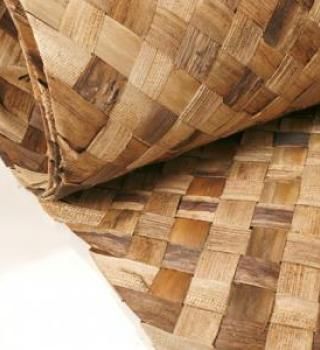 amaZulu bac-bac mats are created by combining banana leaves with fiber from the tree trunk to make a beautiful decorative covering that is biodegradable. Bac-bac mats have the largest amount of color variation out of all amaZulus decorative mat options, featuring a wide range of shades from beige to dark brown. While bac-bac mats absorb moisture, they quickly release moisture making them acceptable for use around water. Learn more at http://www.amazuluinc.com/products/decorative-mats/bac-bac-mat Tropical Building, Banana Tree Leaves, Cladding Materials, Ceiling Treatments, Bamboo Fence, Decorative Ceiling, Bamboo Wall, Banana Leaves, Decorative Wall Panels