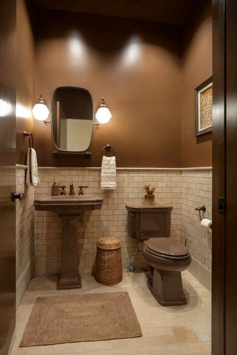 A small brown half bathroom with a warm, rustic feel enhanced by earthy tones and vintage elements. Small Brown Bathroom Ideas, Small Half Bathroom Design, Bar Bathroom Ideas, Tiny Half Bathroom Ideas, Small Half Bathroom Ideas, Half Bathroom Design Ideas, Half Bathroom Ideas, Half Bathroom Design, Small Half Bathrooms