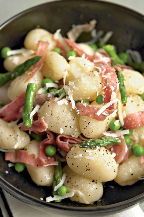 Here, we take the classic Italian pasta pairing of peas and prosciutto, replace the noodles with dumplings, and throw in plenty of asparagus to round out the creation. #pasta #pastarecipe #gnocchi Asparagus Gnocchi, Gnocchi With Peas, Peas And Prosciutto, Prosciutto Recipe, Prosciutto Pasta, Gnocchi Dishes, Side Dishes For Salmon, Prosciutto Recipes, Eat This Not That