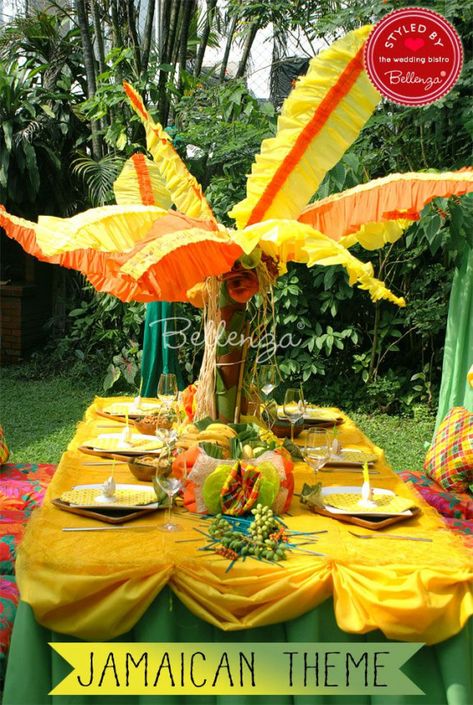 Jamaican-inspired tablescape with Caribbean touches. #jamaicanpartytheme #jamaicanpartydecorations #rastapartytheme #jamaicanengagementparty #50thbirthday #50th #birthday #dinner Caribbean Party Decorations, Caribbean Theme Party, Rasta Wedding, Themed Engagement Party, Rasta Party, Jamaican Party, Engagement Party Themes, Engagement Party Ideas, Jamaican Wedding