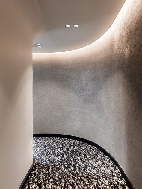 Raphael Navot's Hotel National des Arts & Métiers, Paris Hotel Corridor, Hotel Hallway, Corridor Design, Corridor Lighting, Stone Pillars, Hotel Entrance, Cove Lighting, Hand Carved Stone, Wall Carpet