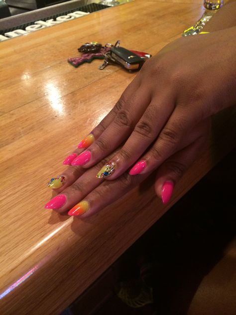 Summer ombré nails, hot pink, neon orange, and neon yellow with multi colored rhinestones, almond shaped stiletto nail Gel Shellac Nails, Nails Hot Pink, Orange Ombre Nails, Summer Nails Colors Designs, Summer Nails Almond, Orange Nail Designs, Ombré Nails, Pink Ombre Nails, Hot Pink Nails