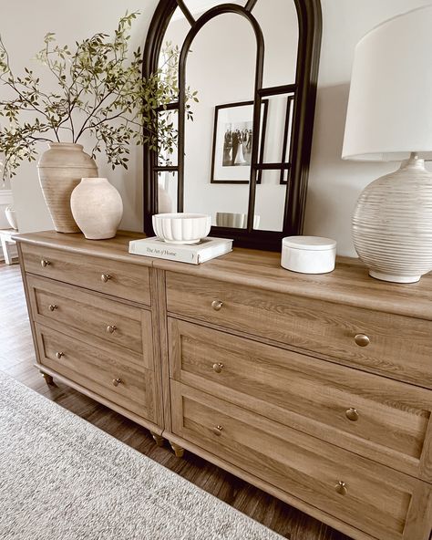 Before moving this dresser into our entryway hallway, I styled it in the front foyer. I loved the simplicity and serenity of the Neutral tones and natural textures create a calming entryway that invites warmth and peace from the moment you step inside. 🌟The first two pictures are what I styled before I decided to switch up the living room. The last three are what I ended up doing. 🤔What are your thoughts? Do you like the final result? Which one is your favorite? #HomeDecorInspo #Neutral... Buffet Table Living Room Decor, Clean Lines Living Room, Dresser In Entryway, Entryway In Living Room, Dresser Styling Bedroom, Entry Table Styling, Styled Dresser, Home Entryway Ideas, Dresser Top Decor