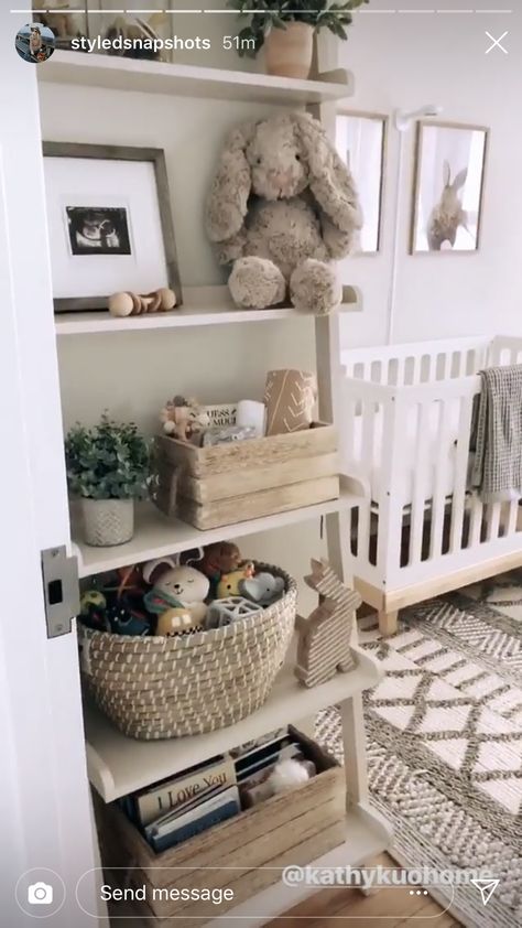 Open Shelf Nursery, Neutral Nursery Bookshelf, Nursery Ladder Shelf, Ladder Shelf In Nursery, Nursery Bookcase Ideas, Bookshelf For Nursery, Corner Bookshelves Nursery, White Nursery Bookshelf, Ladder Bookshelf Nursery