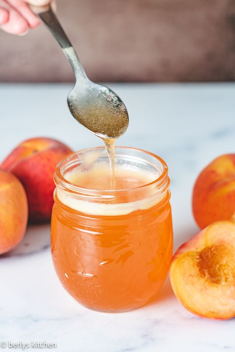 Get the full recipe on berlyskitchen.com. Peach Syrup is a great way to add peach flavor to your favorite drinks, cocktails, and desserts. It's also wonderful for drizzling over pancakes and French toast, too! Peach Syrup Recipe, Peach Syrup, Simple Syrup Recipes, Pancake Syrup, Homemade Syrup, Drinks Cocktails, Flavored Syrup, Jelly Recipes, Peach Recipe