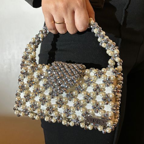 In frame: Starlit Bag This bag features a stunning arrangement of pearls and crystals, creating a radiant and luxurious look. Ideal for weddings, pre-wedding events, or any special occasion, the Starlit Handbag will make you stand out with its unique design and exquisite craftsmanship. #bag #pearl #beads #beading #loveyourself #hangbag #wedding #fyp #explore #foryou #pinterest #pinterestinspired #aesthetic #aestheticedits Diy Pearl Necklace, Hand Beaded Bag, Pearls Diy, Crystal Bags, Pearl Bag, Beaded Handbag, Beaded Purses, Hanging Bag