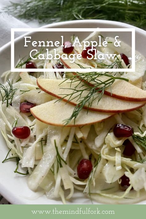 Fennel, Apple & Cabbage Winter Slaw close up with pomegranate seeds in a white bowl. Apple Fennel Slaw Recipe, Apple Cabbage Slaw, Winter Slaw, Apple Cabbage, Slaw Salad, Fennel Slaw, Plant Based Recipes Dinner, Vegan Cheese Recipes, Apple Slaw