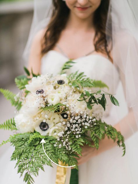 Anemone is one of the only flowers that's naturally black and white, making it a popular choice for black tie weddings. Ranunculus Bridal Bouquet, Fern Bouquet, Wedding Flowers White, Ranunculus Bouquet, Fern Wedding, Green Wedding Bouquet, White Boutonniere, White Ranunculus, White Anemone