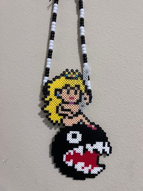 Princess Peach Perler With Beaded Necklace - Wrecking Ball Style Size: Perler with Necklace 20 inches           Necklace 11 1/2 inches **All items are hand made to order by me, please keep in mind  what you receive may vary a little from the photos, beads may melt differently than shown in the pictures. Princess Peach Perler, Peach Perler, Perler Bead Necklace, Rave Perler, Kandi Perler, Perler Necklace, Perler Bead Designs, Pony Bead Bracelets, Art Perle