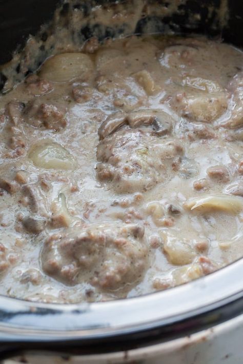 I LOVE this SLOW COOKER Salisbury Steak With Cream of Mushroom Soup! This CROCKPOT recipe is easy to make and is ready in 5 hours! It's made with dry onion soup mix and cream of mushroom soup to make a comforting gravy your entire family is going to love! I always serve on egg noodles or with mashed potatoes! This is one of my favorites simple weeknight meals! Crockpot Salisbury Steak Recipe, Crock Pot Salisbury Steak, Crockpot Salisbury Steak, Salisbury Steak Crockpot, Salisbury Steak Recipe, Slow Cooker Salisbury Steak, Swiss Steak, Salisbury Steak Recipes, Cream Of Mushroom Soup