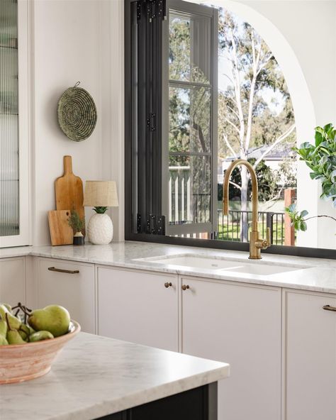 Quality craftsmanship and materials are at the heart of all our projects. This kitchen features a striking custom range hood design, acid washed brass hardware, marble countertops, and organic bejmat tiles adding beauty to every element. #BespokeInteriors #KitchenDesign #TimelessInteriors Range Hood Design, Bejmat Tiles, Custom Range Hood, Hood Design, Timeless Interiors, Bespoke Interiors, Kitchen Features, Marble Countertops, Range Hood