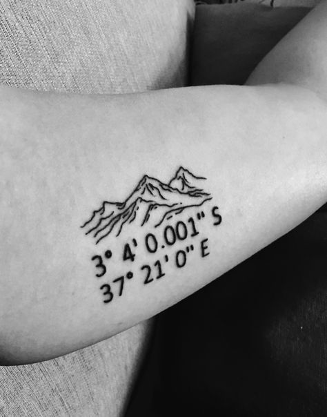 My mountain tattoo with coordinates of Uhuru Peak #mountain #Kilimanjaro #UhuruPeak #tattoo #innerbicep Coordinates Tattoo Mountain, Mens Mom Tattoo, Mountain Coordinates Tattoo, Smoky Mountains Tattoo Ideas, Longs Peak Tattoo, Mt Kilimanjaro Tattoo, Mountain Tattoo With Coordinates, Tattoos With Coordinates, Glacier National Park Tattoo