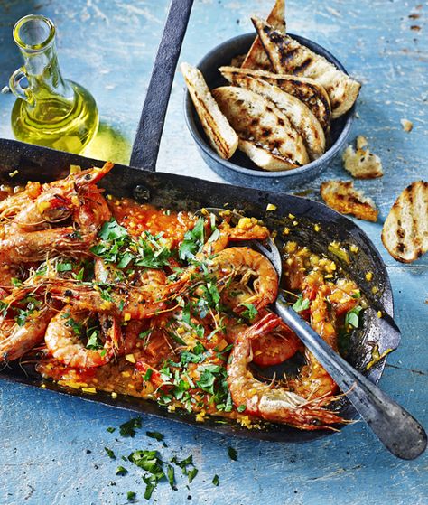 This wonderful seafood dish is traditionally made with scampi. Langoustine would be closest, but large prawns work well Prawn Saganaki, Saganaki Recipe, Rick Stein, Yummy Seafood, Coquille Saint Jacques, Prawn Recipes, Bbc Food, Steak House, Fish Dishes