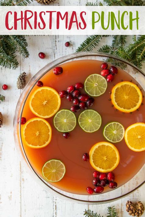 This easy non-alcoholic Christmas Punch is a festive, fun and delicious holiday punch. It's kid-friendly but can easily be spiked for adults! Easy Christmas Punch, Holiday Party Punch, Non Alcoholic Christmas Punch, Best Christmas Punch Recipe, Christmas Morning Punch, Cranberry Ginger Ale, Cinnamon Christmas, Holiday Punch Recipe, Cranberry Punch