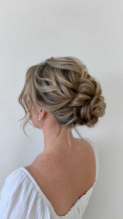 Low Messy Bun Wedding Hair Loose Curls, Messy Curly Bun Wedding, Debs Hair Updo, Prom Updos Bun, Low Messy Bun Prom Hair, Deb Hairstyles Bun, Low Messy Wedding Bun, Low Updo Prom Hair, Prom Hair Bun Low