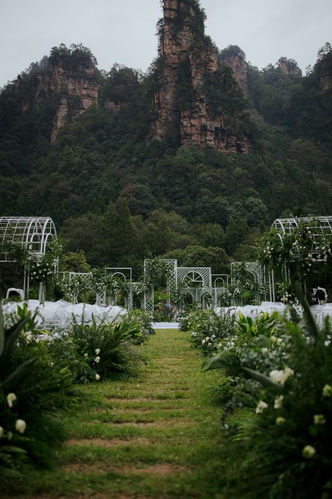 Ceremony Aisle With Greenery Decorations Greenery Decorations, Zhangjiajie China, Ceremony Aisle, Chinese Heritage, Wedding Planner App, Honeymoon Style, Zhangjiajie, Chinese Tea Ceremony, Wedding Proposals