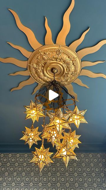 Helena Garcia on Instagram: "I’ve been working on the biggest bedroom in the house for weeks! And although it isn’t quite finished I wanted to show you what I did with the main light fitting.  It seems the Victorians limited their ceiling roses and ornate covings etc to the ground floor as there’s none upstairs but I found this reclaimed one on marketplace for £20! It’s huge but this room is so big it doesn’t look it.  It is a south facing bedroom and incredibly light so I thought it would be nice to represent that with a sun shape ceiling rose 🌞 The paint and wallpaper both came from @warnerhouse_1870 and I have to say that the paint was so thick I only needed to do one coat! With the size and height of this ceiling let me tell you that was a godsend!  I hope you like it ☺️  #interiordes Witchy Ceiling Light, Fantasy Ceiling Light, Gold Stars Ceiling, Star Lighting On Ceiling, Star Ceiling Medallion, Sun Ceiling Design, Mural Ceiling Ideas, Sun Ceiling Light, South Facing Bedroom