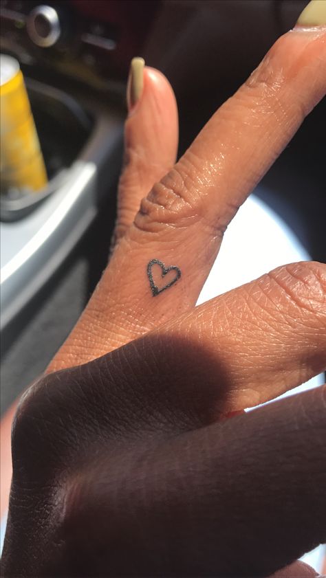 Heart tattoo on left ring finger. Simple but fashionable Small Heart Finger Tattoos For Women, Small Heart Tattoos On Finger, Small Inner Finger Tattoos For Women, Heart Tattoo Ring Finger, Heart Tattoo On Finger For Women, Finger Tats For Women Simple, Small Heart Tattoo On Ring Finger, Love Heart Tattoo Finger, Tiny Rose Tattoo Finger