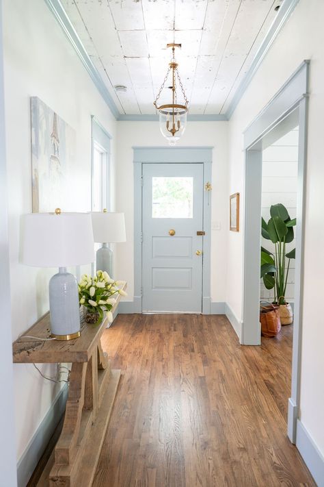 Historic Home Renovation - Home Tour - Farmhouse Living - Gold Pendant Light - Shiplap Ceiling - Sleepy Blue Trim - Blue Painted Front Door - Entry Way Inspiration - Hardwood Floors Blue Ceiling Entryway, Blue Trim Living Room, White Blue Wall Paint, Blue Interior Trim And Doors, Blue Front Door Interior, White Walls Blue Accent Wall, Light Blue Foyer, Light Blue Farmhouse Living Room, Blue Painted Trim Bedroom