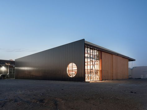 Hangar Architecture, Warehouse Facade, Warehouse Architecture, Hangar Design, Factory Architecture, Commercial And Office Architecture, Warehouse Design, Air Ambulance, Factory Building