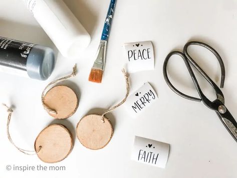 Wood Slice Ornaments Diy, Word Ornaments, Wood Slice Ornaments, White Paint Pen, Christmas Words, Wood Slice Ornament, Black Sharpie, Gift Toppers, White Acrylic Paint