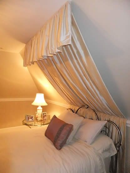 Want to do something similar with the sloped ceilings in the bedroom Slanted Ceiling Headboard, Canopy Slanted Ceiling, Angled Wall Decor Sloped Ceiling, Bedrooms With Slanted Ceilings, Bedroom With Slanted Ceiling, Alternative Headboard, Slanted Ceiling Bedroom, Sloped Ceiling Bedroom, Hanging Canopy