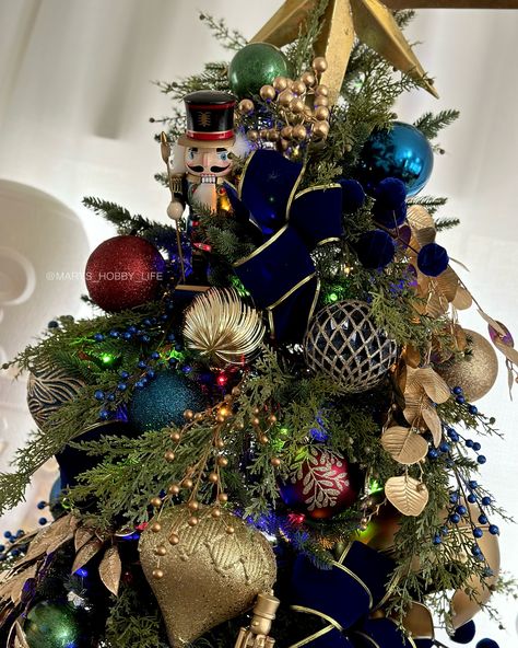 Nutcracker Christmas Tree Ideas, Nutcracker Christmas Decorations Ideas, Jewel Toned Christmas Tree, Nutcracker Christmas Tree Theme, Nutcracker Themed Christmas Tree, Professional Christmas Tree, Nutcracker And The Four Realms, Nutcracker Christmas Tree, Elegant Christmas Tree Decorations