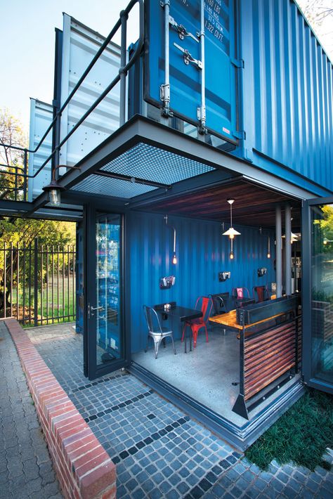 The granite cobblestones that form the floor of the couryard outside the coffee shop are made from tombstone offcuts and the aluminium stacking doors are by DST Glass and Aluminium. Architecture References, Container Coffee Shop, Van Project, Container Van, Container Restaurant, Silo House, Container Cafe, Used Shipping Containers, Container Conversions